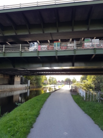 The canal cuts beneath two decks of 70-50 traffic